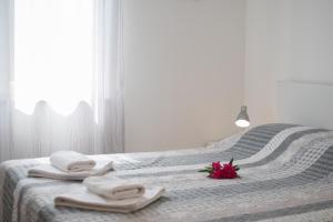 Postel nebo postele na pokoji v ubytování Villas Faro