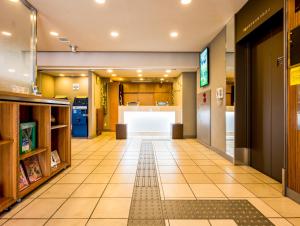 an empty hallway of a store with a counter at Super Hotel Saitama Omiya West in Saitama