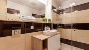 Kúpeľňa v ubytovaní VacationClub - Olympic Park Apartment A604