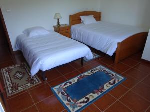 Uma cama ou camas num quarto em Hospedaria Lampião