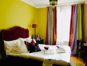 Postel nebo postele na pokoji v ubytování Dorsia Hotel & Restaurant