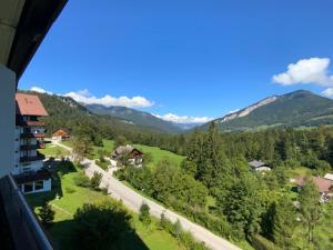 a view from the balcony of a house in the mountains at Alpenblick Suite in Bad Goisern
