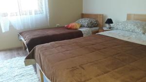 A bed or beds in a room at Apartment Sijakovic