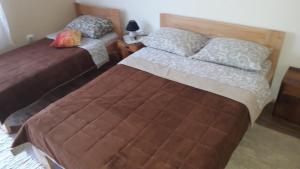 A bed or beds in a room at Apartment Sijakovic