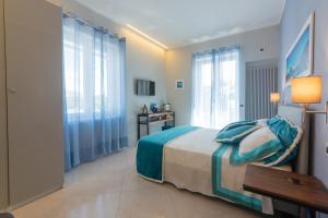 Postel nebo postele na pokoji v ubytování B&B La Piazzetta