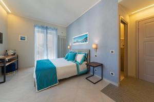 Postel nebo postele na pokoji v ubytování B&B La Piazzetta