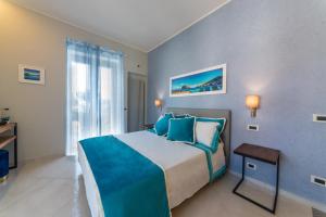 Postel nebo postele na pokoji v ubytování B&B La Piazzetta