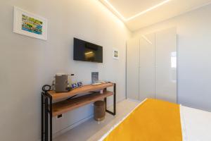 Postel nebo postele na pokoji v ubytování B&B La Piazzetta