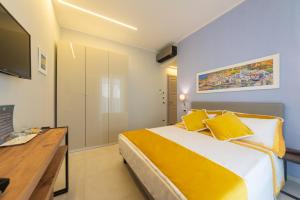 TV a/nebo společenská místnost v ubytování B&B La Piazzetta