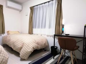 En eller flere senge i et værelse på クレアゲハウス新百合ケ丘