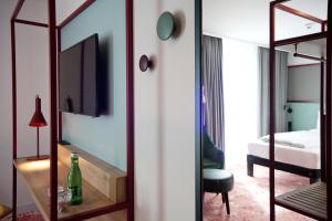 ibis Styles Klagenfurt am Woerthersee客房内的一张或多张床位