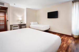 Postel nebo postele na pokoji v ubytování B&B HOTEL Castellón