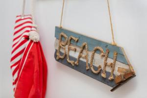 a sign that says christmas hanging on a wall at Marine Apartment 9B by Renters in Dziwnówek