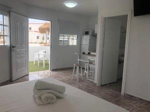 a bedroom with a bed with a pillow on it at Apartamentos Elena in Lajares