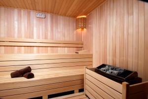 a wooden sauna with a wooden tub in it at Ramira City Hotel - Adult Only (16+) in Alanya