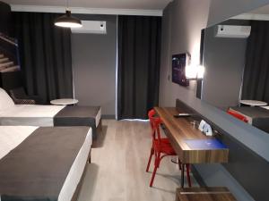 Ein Bett oder Betten in einem Zimmer der Unterkunft Ramira City Hotel - Adult Only (16+)
