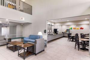 a waiting room with a couch and chairs and tables at Quality Inn Cedar Park - Austin Northwest in Cedar Park