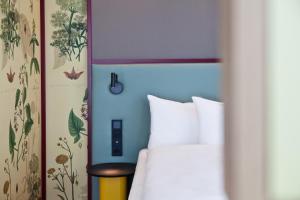 ibis Styles Klagenfurt am Woerthersee客房内的一张或多张床位