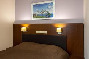 Postel nebo postele na pokoji v ubytování Viiking Spa Hotel