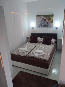 Postel nebo postele na pokoji v ubytování Apartman Deluxe