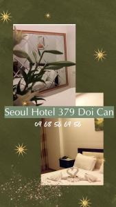 una imagen de una habitación con cama y espejo en Seoul Hotel Doi Can en Hanoi