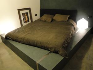 En eller flere senge i et værelse på Relais Cattedrale