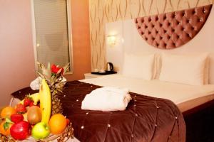 Postel nebo postele na pokoji v ubytování Adanava Hotel