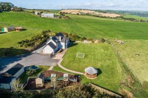 an aerial view of a house in a field at Four Winds,Kinsale Town,Exquisite holiday homes,sleeps 26 in Kinsale