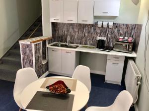 Kuchyň nebo kuchyňský kout v ubytování Árkád Apartmanház Szeged