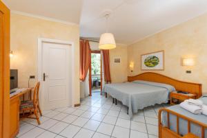 Postel nebo postele na pokoji v ubytování Hotel Kyrton
