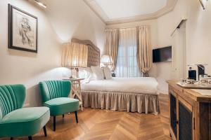 Voodi või voodid majutusasutuse Corte Calzaiuoli Elegant Suites toas