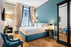 Voodi või voodid majutusasutuse Corte Calzaiuoli Elegant Suites toas