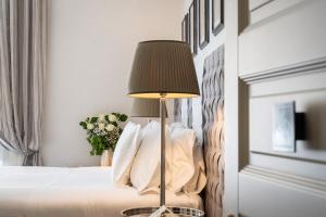 Voodi või voodid majutusasutuse Corte Calzaiuoli Elegant Suites toas