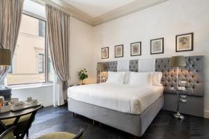 Voodi või voodid majutusasutuse Corte Calzaiuoli Elegant Suites toas