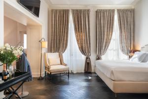 Voodi või voodid majutusasutuse Corte Calzaiuoli Elegant Suites toas