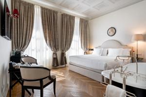 Voodi või voodid majutusasutuse Corte Calzaiuoli Elegant Suites toas