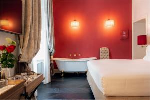 Voodi või voodid majutusasutuse Corte Calzaiuoli Elegant Suites toas