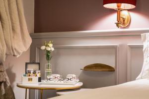 Voodi või voodid majutusasutuse Corte Calzaiuoli Elegant Suites toas