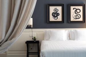 Voodi või voodid majutusasutuse Corte Calzaiuoli Elegant Suites toas