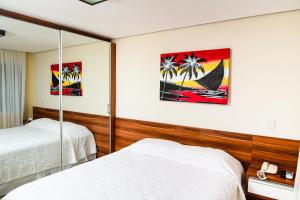 Postel nebo postele na pokoji v ubytování Aquaria Natal Hotel