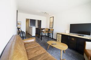 Μια τηλεόραση ή/και κέντρο ψυχαγωγίας στο Appartement Caraibes 8ste verdieping