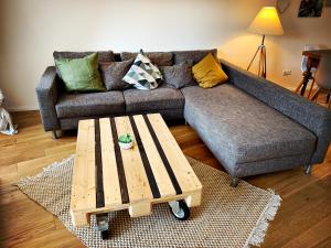 a living room with a couch and a coffee table at Schwarzer Adler in Michelstadt