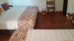 La Loma Hotel Barichara tesisinde bir odada yatak veya yataklar
