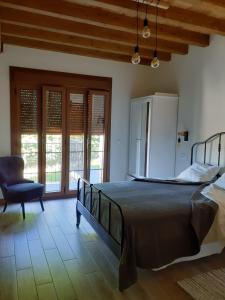Postel nebo postele na pokoji v ubytování Apartamentos y Casa La Paredana, agroturismo
