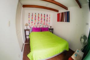 Un ou plusieurs lits dans un hébergement de l'établissement Dragonfly Hostels Miraflores