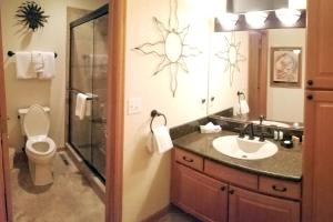 a bathroom with a toilet and a sink and a shower at Breckenridge Mtn Village 132 - Beautiful Private Home just blocks from Main Street in Breckenridge