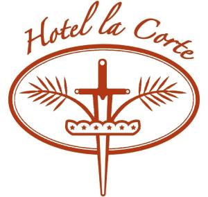 a cross and the words hotel la costanza at Hotel La Corte in Correzzola