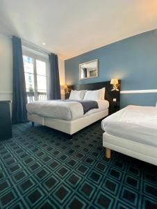 Кровать или кровати в номере Hôtel Etoile Trocadéro