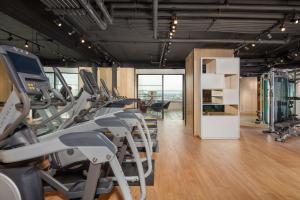 a gym with treadmills and machines in a room at The Windsor Suites Philadelphia in Philadelphia