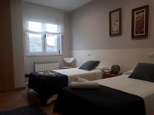 A bed or beds in a room at Ultreia
